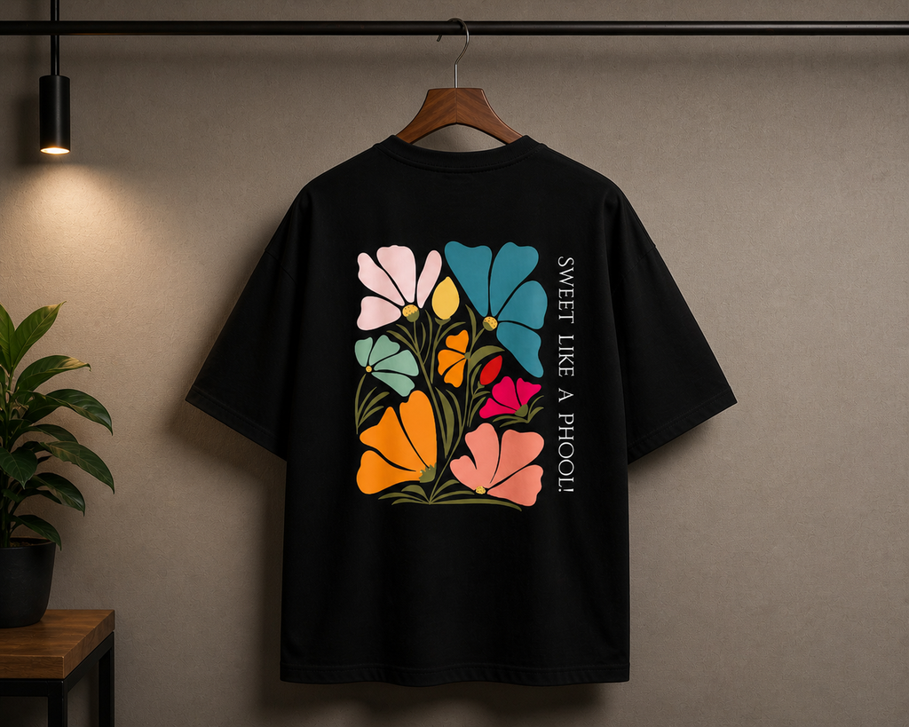 Black oversized T-shirt by Street Gully with minimal floral graphic design, styled casually on a model.