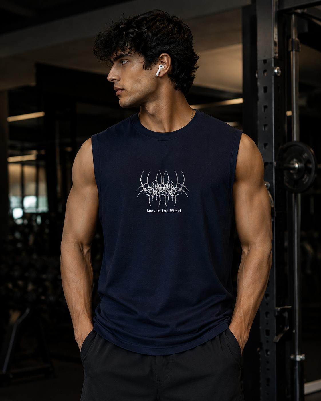 Navy blue men’s gym tank top with “Lost in the Wired” metallic graphic print and oversized sleeveless fit.