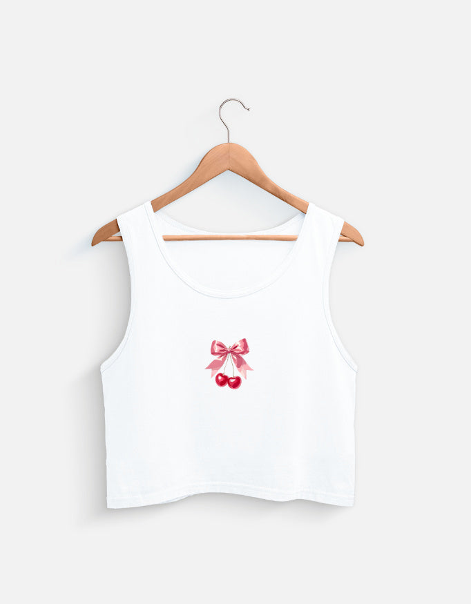 White women's crop tank top with pink bow and cherry graphic design