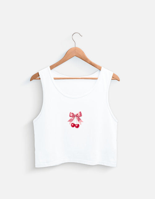 White women's crop tank top with pink bow and cherry graphic design