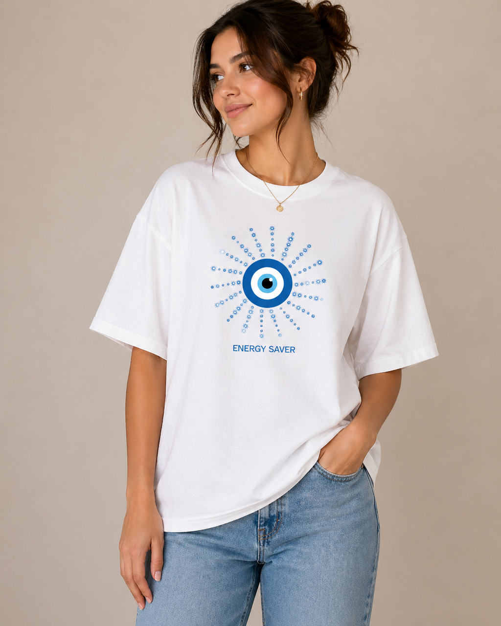Women wearing white oversized t shirt with blue evil eye energy saver graphic design on chest