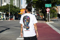White oversized graphic T-shirt by Street Gully featuring bold dual reality design on heavyweight cotton fabric.
